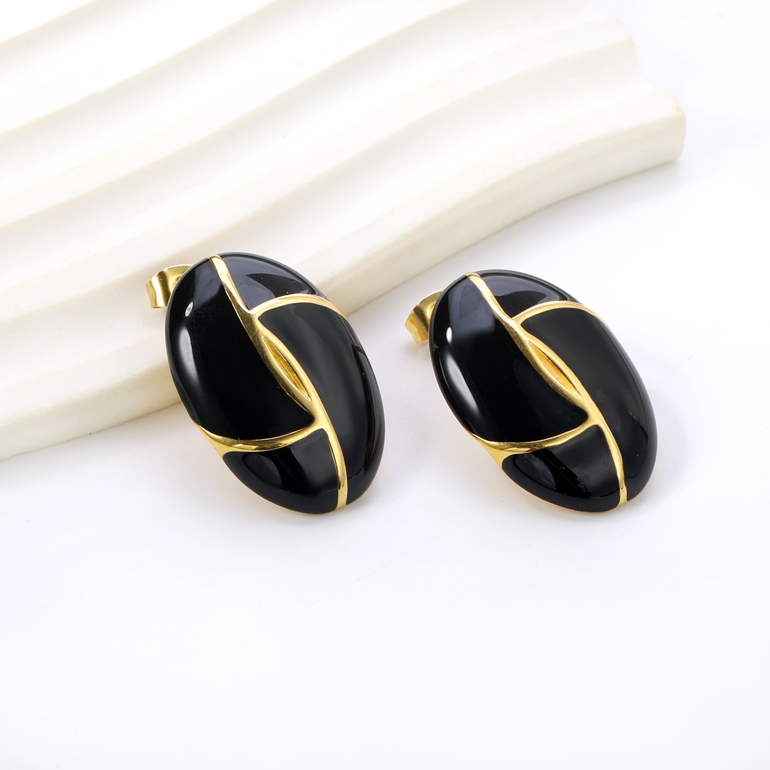 Gold-Trimmed Black Enamel Oval Leaf Stud Earrings
