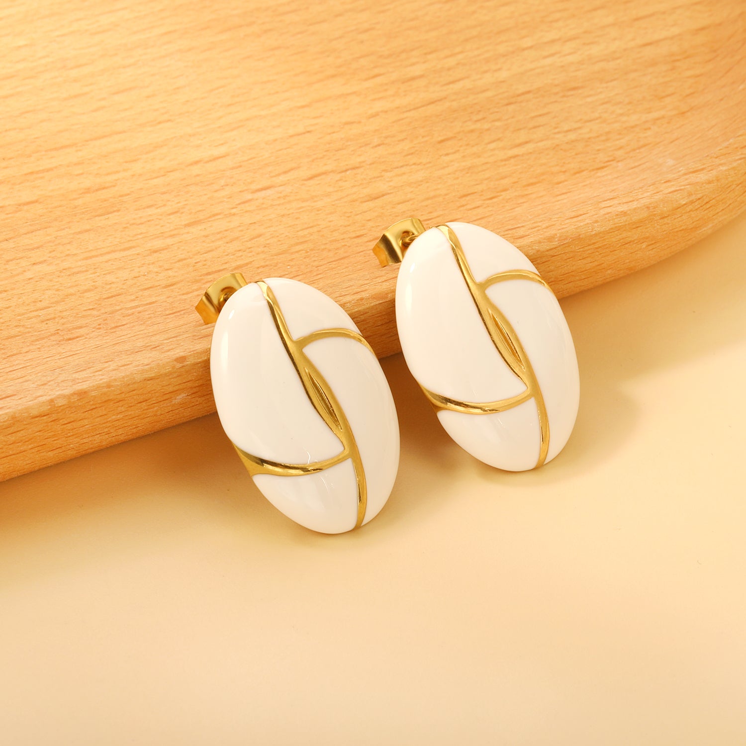 Gold-Trimmed White Enamel Oval Leaf Stud Earrings