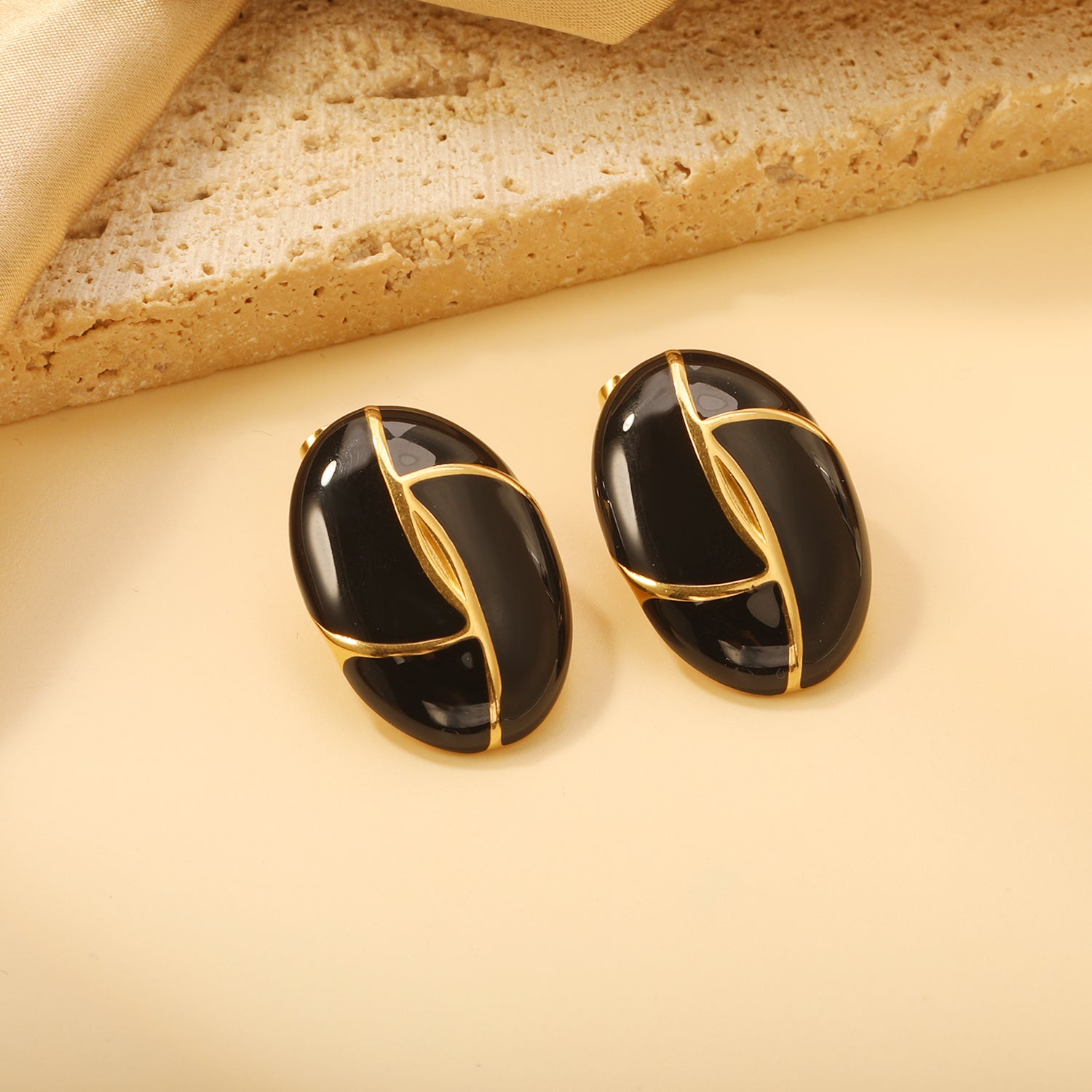 Gold-Trimmed Black Enamel Oval Leaf Stud Earrings
