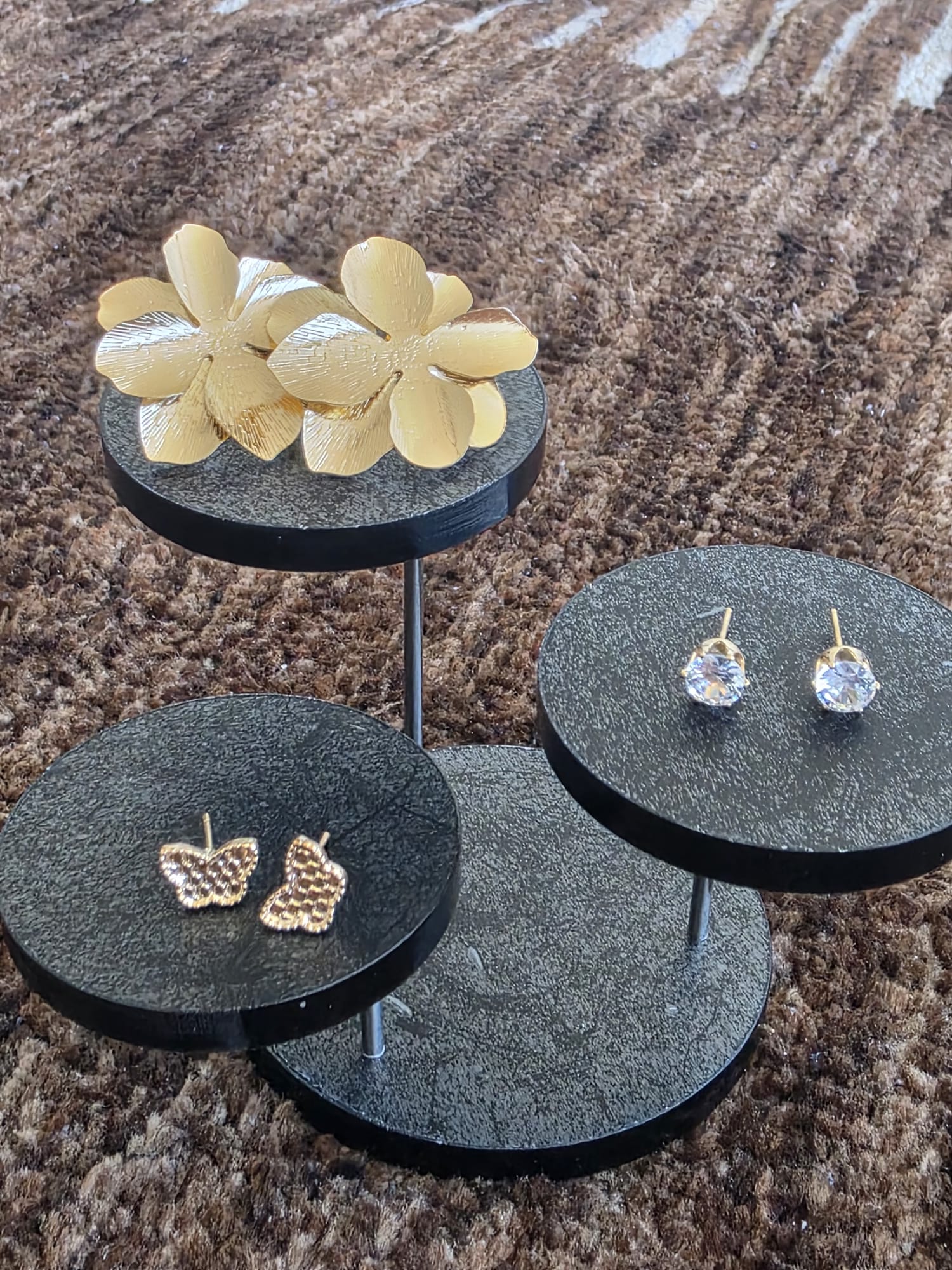 A Trio of Elegance: Tiered Earring Collection
